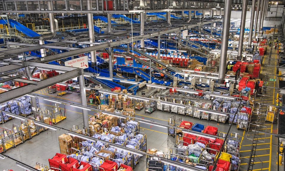 Postal sorting facility with conveyors, mail bags and roll cages